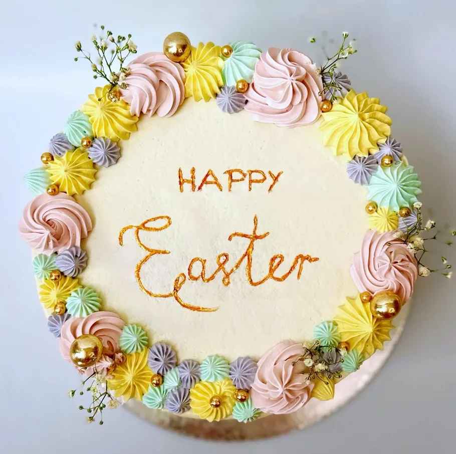 Decorated cake with 'Happy Easter' text.