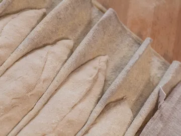 Cloth bags are arranged in a circular container.