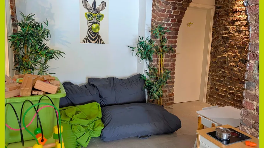 Children's playroom with cushions and zebra artwork.