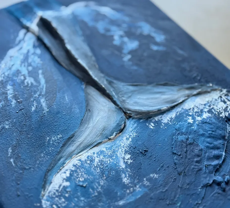 Whale tail painting with textured blue background.