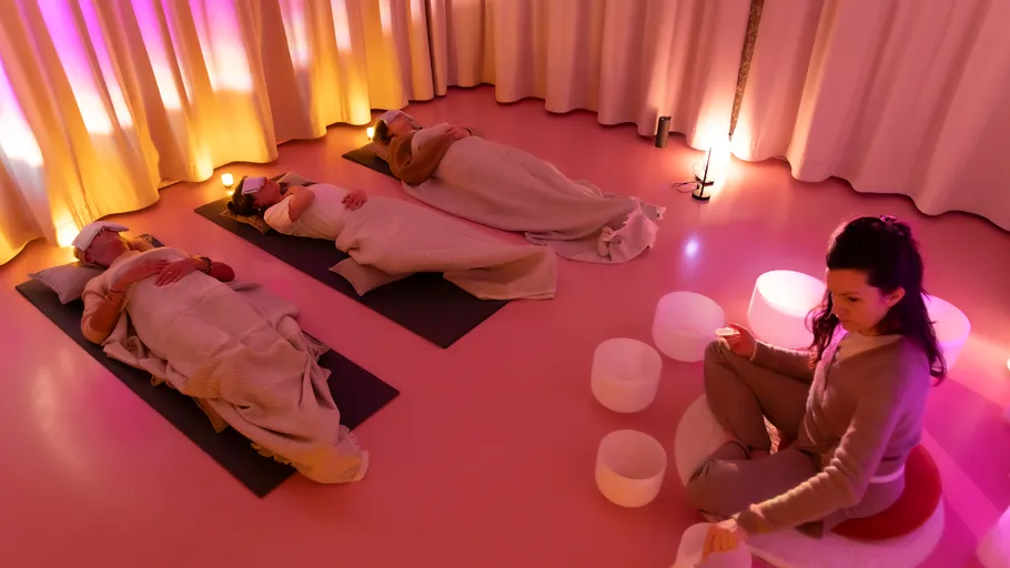 People relaxing in a dimly lit room.