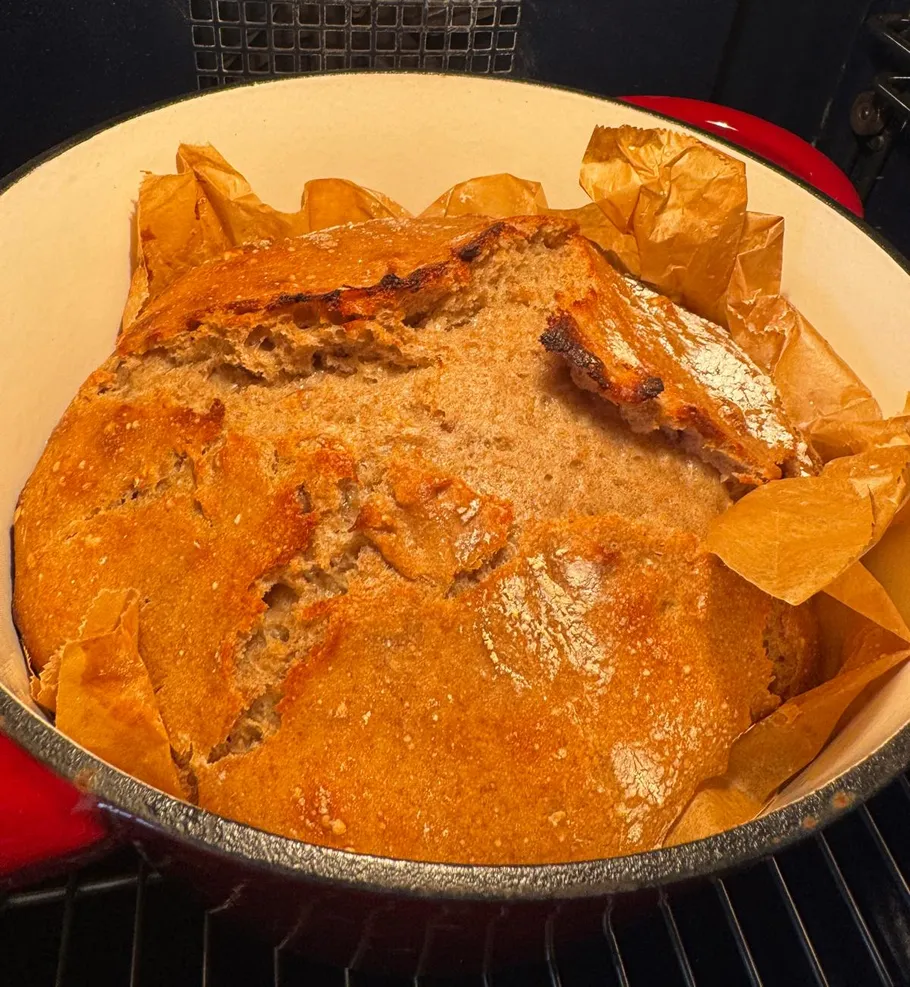 Freshly baked bread in a Dutch oven.
