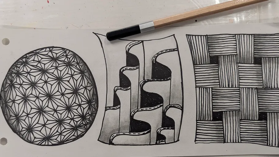 Three intricate black-and-white pen drawings.
