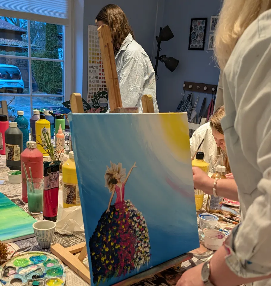 People painting in a creative art studio.