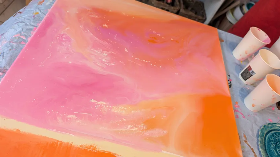 Colorful abstract painting on a table.