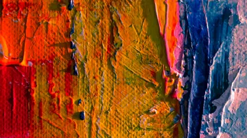 Colorful abstract painting with thick textured brushstrokes.