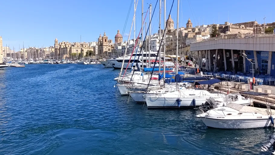 Boats docked in a Mediterranean marina.