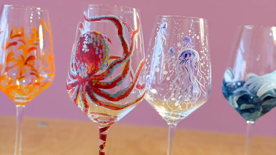 Painted wine glasses with sea creature designs.