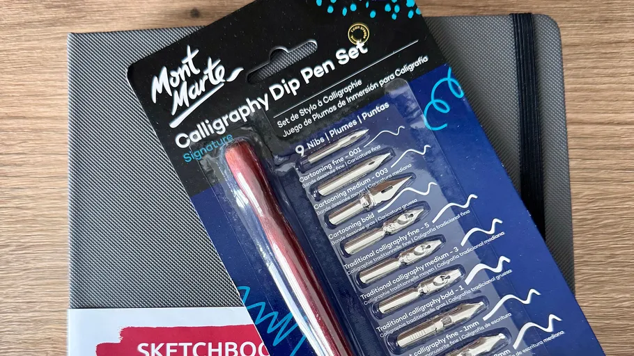 Calligraphy pen set on a sketchbook.