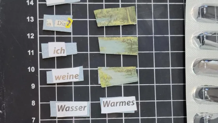 Cut-out words on grid paper with pill packet.