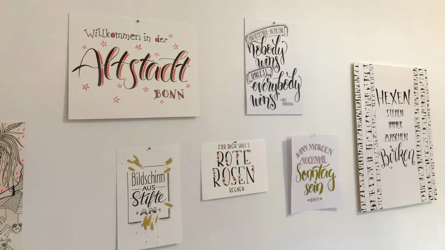 Decorative wall with various inspirational quotes.