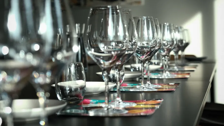 Wine glasses arranged on a table.