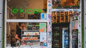 Small shop with pastries and beverages inside.