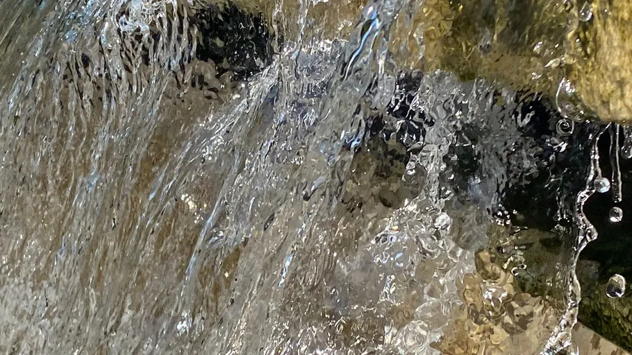 Water flowing over rocks in nature.