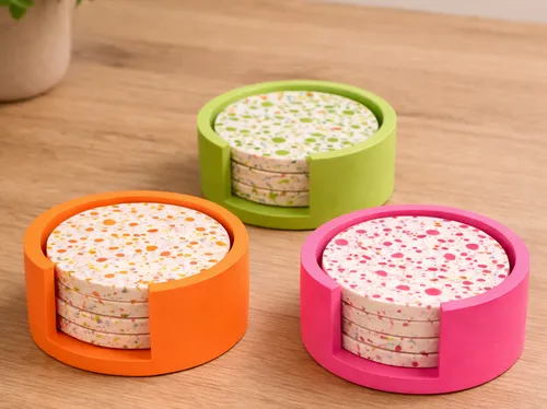 Colorful coasters in holders on wooden table.