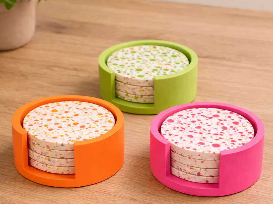 Colorful coasters in holders on wooden table.