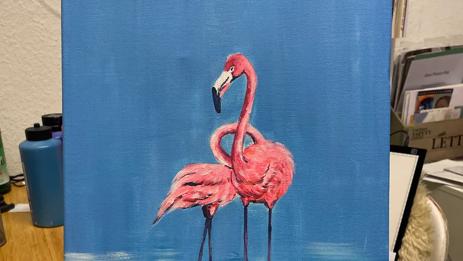Canvas painting of flamingos with blue background.