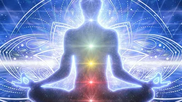 Silhouette meditating with glowing chakras, cosmic background.