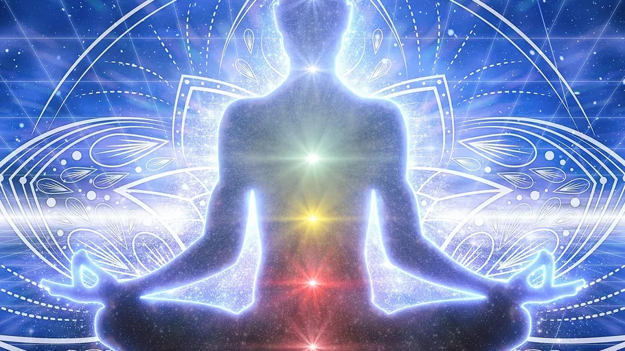 Silhouette meditating with glowing chakras, cosmic background.