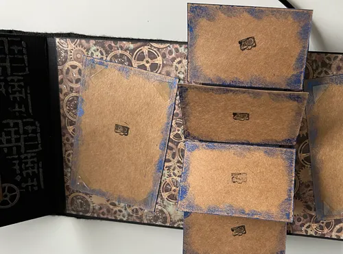 Brown cards with camera icons, gear background.