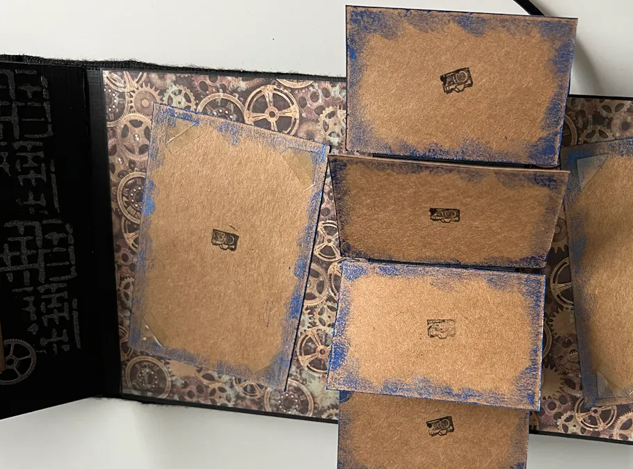 Brown cards with camera icons, gear background.