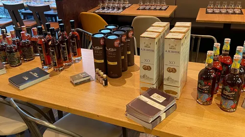 Bottles and boxes of spirits on a table.