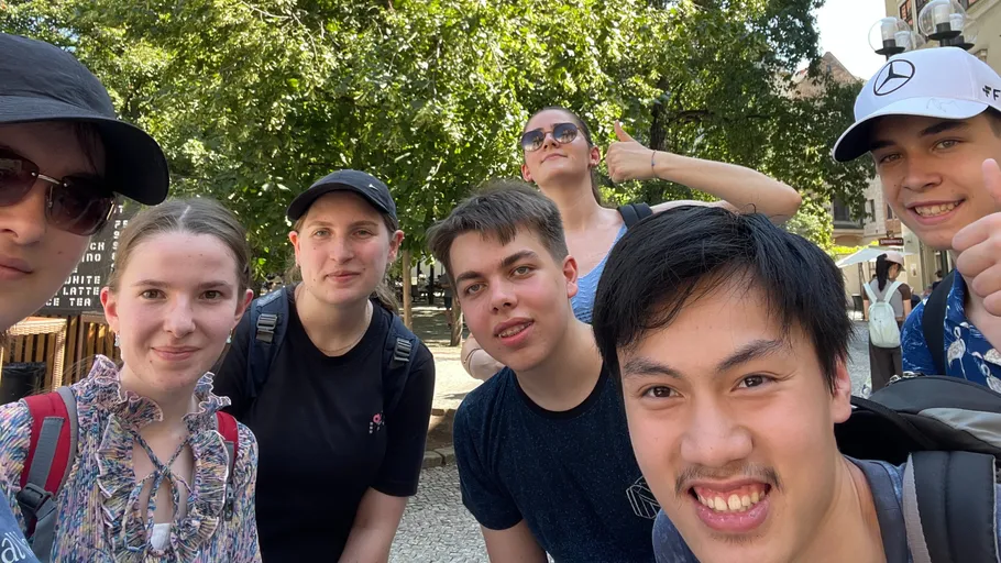 Group of young people smiling outdoors.