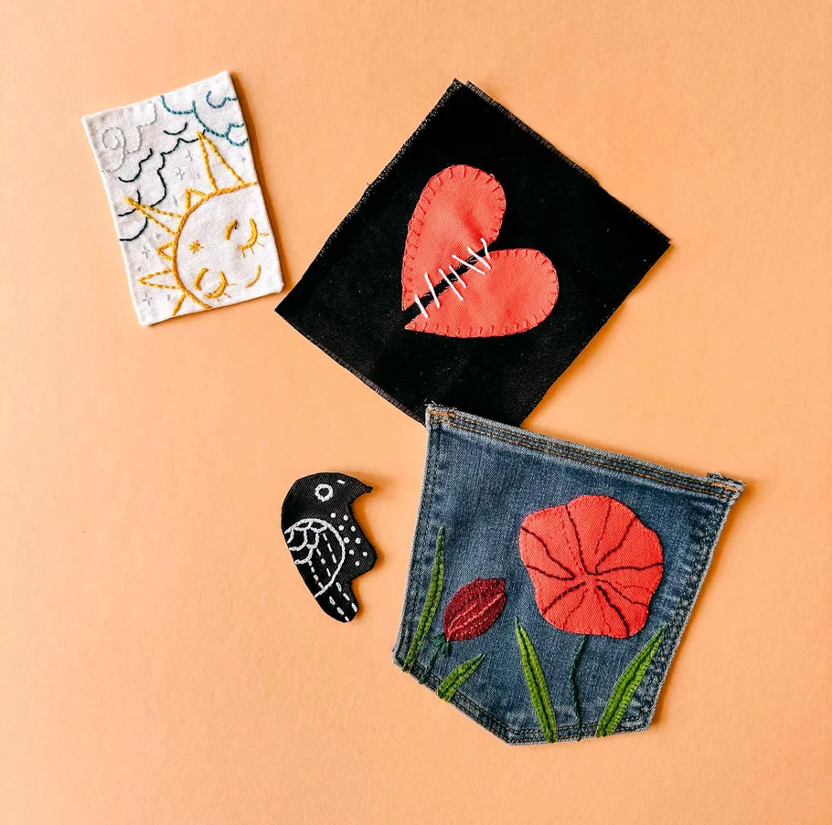 Colorful embroidered patches on orange background.