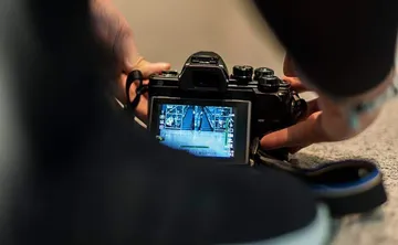 Camera on floor photographing escalator inside.