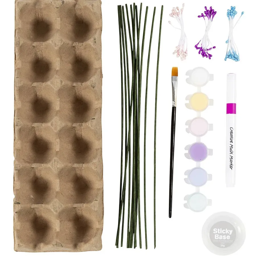 Craft kit materials arranged neatly on white background.