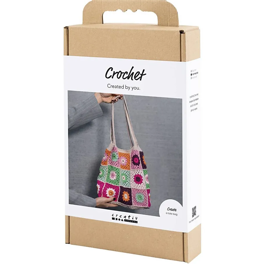 Häkelset-Box mit buntem Taschenbild.