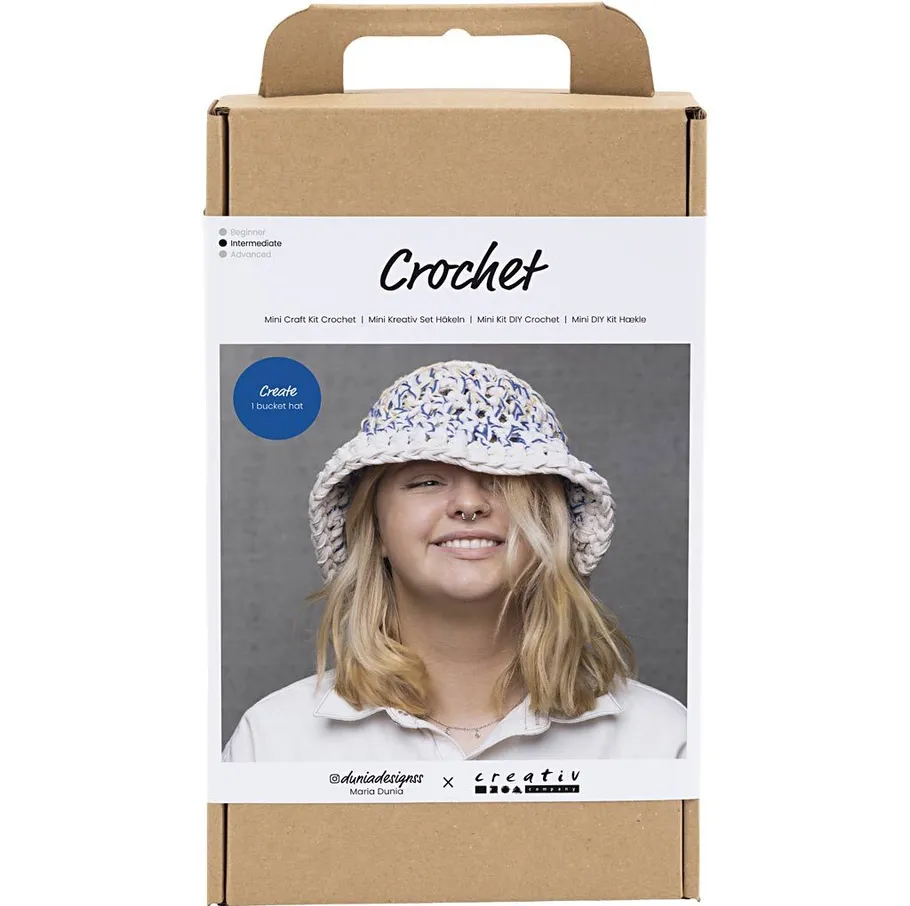 Crochet kit box with smiling woman wearing hat.