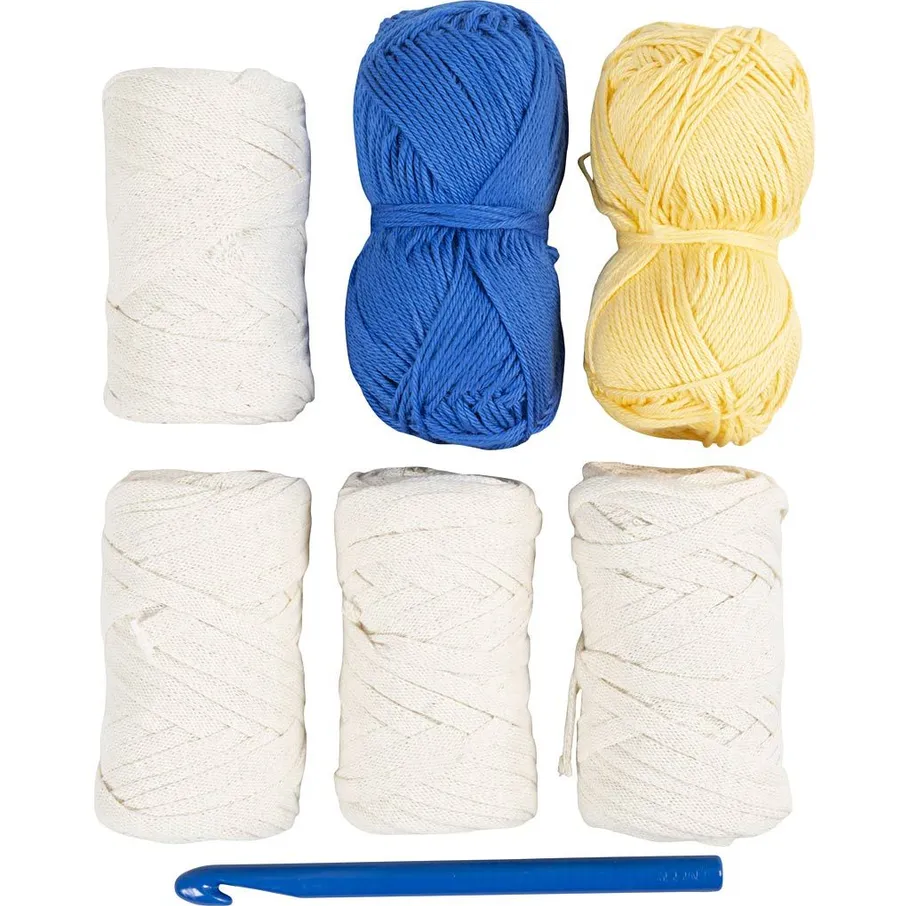 Yarn and crochet hook on white background.