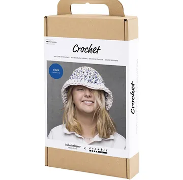Crochet kit box with smiling woman photo.