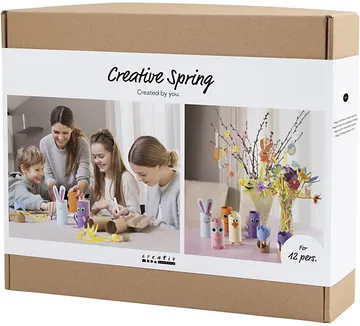 Children crafting with colorful materials at table.