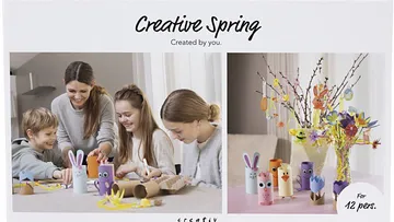 Familie bastelt gemeinsam bunte Frühlingsdekorationen.
