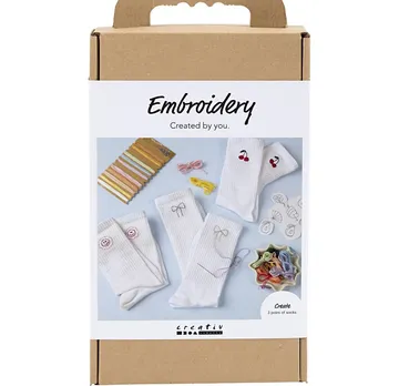 Embroidery kit with socks and thread supplies.
