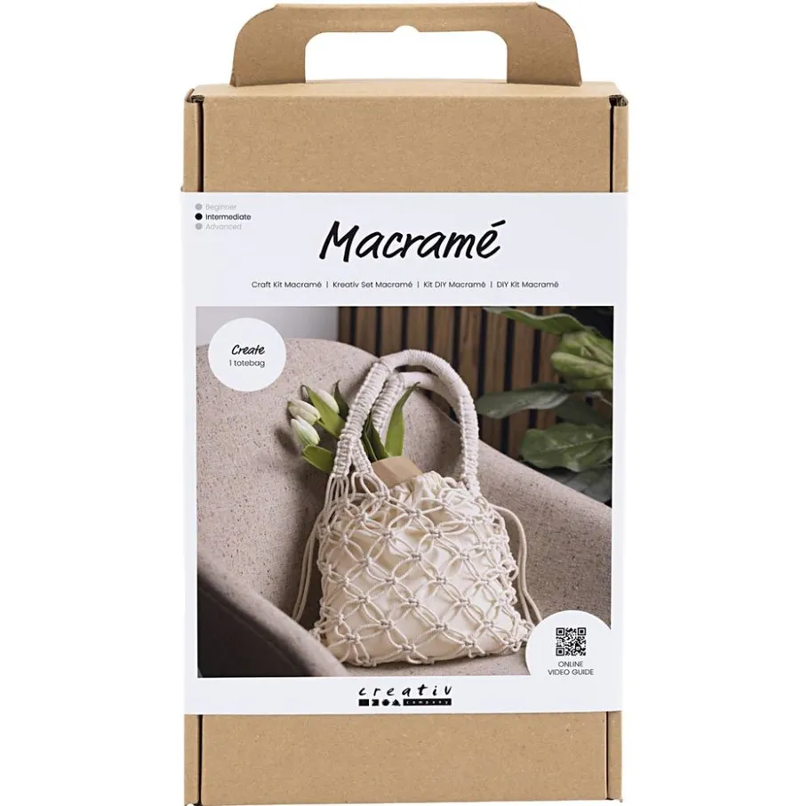 Macramé tote bag kit on cardboard box.