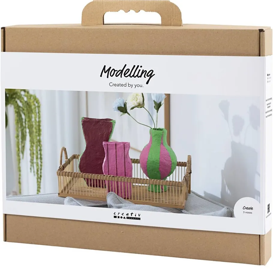 Modeling kit box with decorative vases.