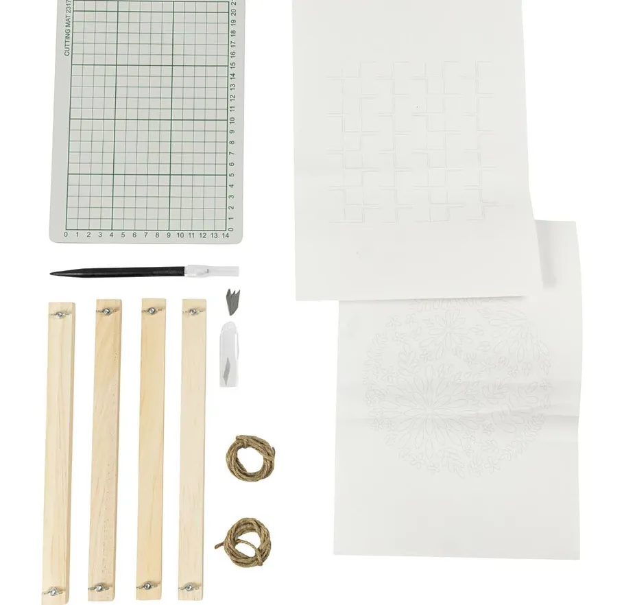 Craft kit with cutting mat and tools arranged.