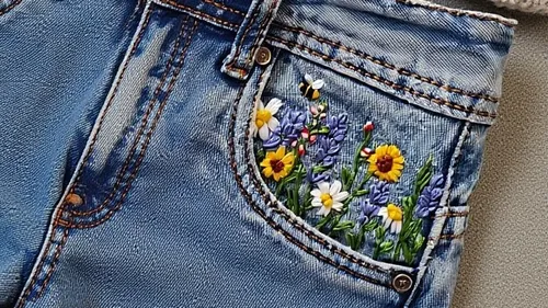 Embroidery of flowers on jeans pocket.