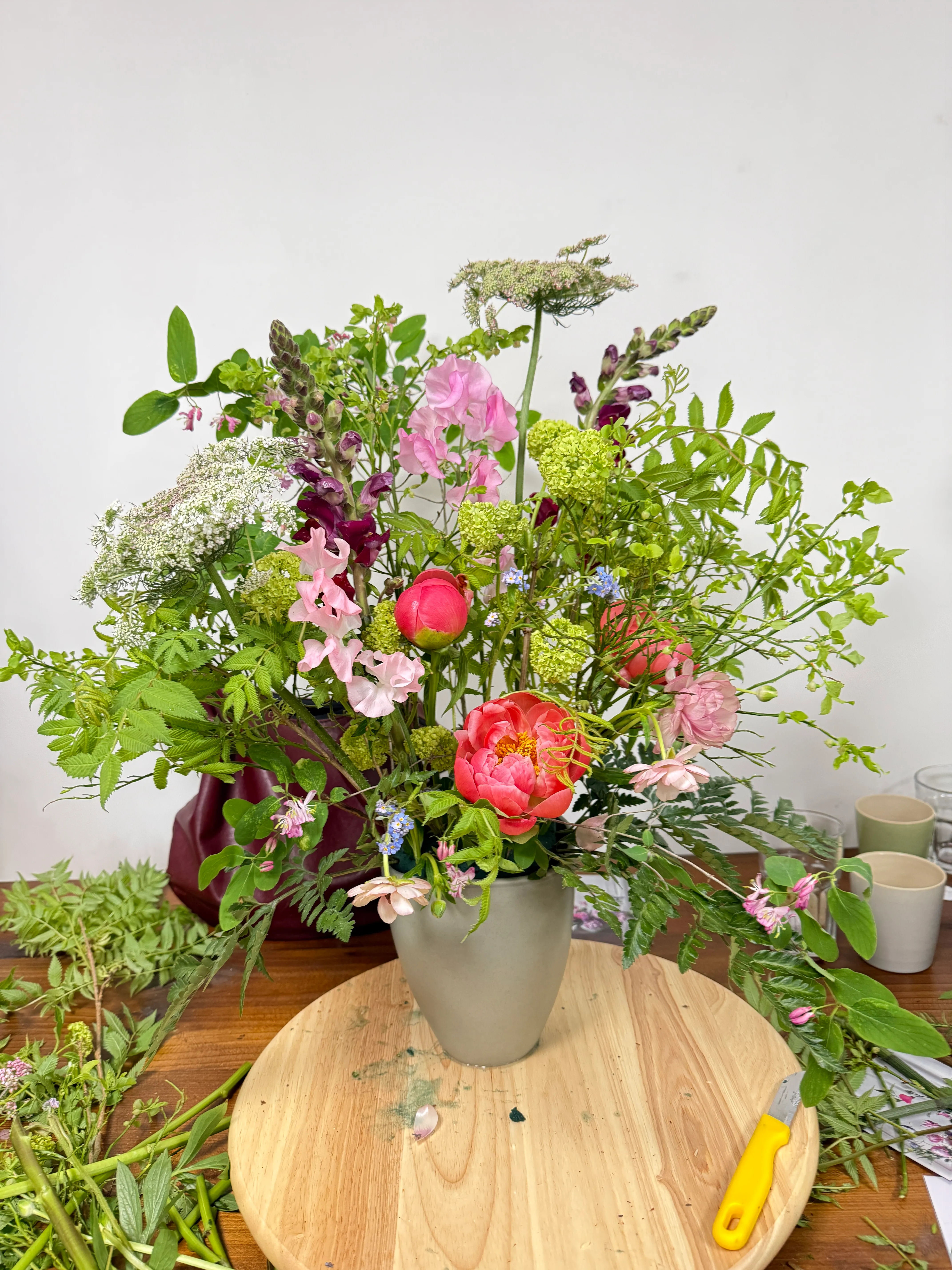 Colorful flower arrangement in a ceramic vase.