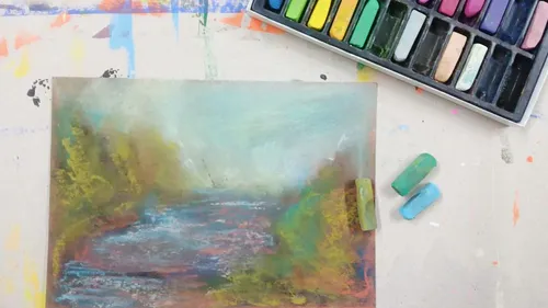 Pastelllandschaft mit Pastellbox auf Tisch.