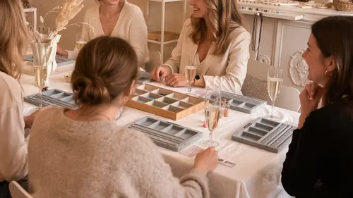 Women seated at a table, enjoying drinks.