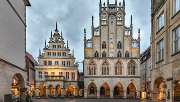 Gothic-style building in a city square.