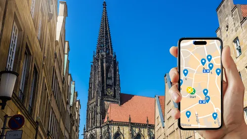 Hand holds phone with map near Gothic church.