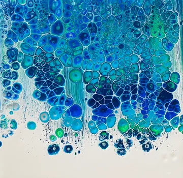 Blue abstract pattern with cell-like structures.