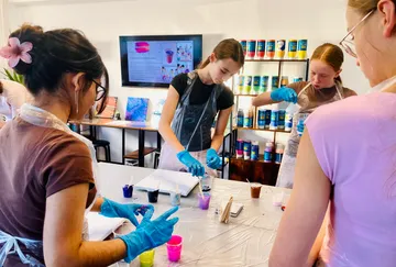 People doing art activity at a workshop.