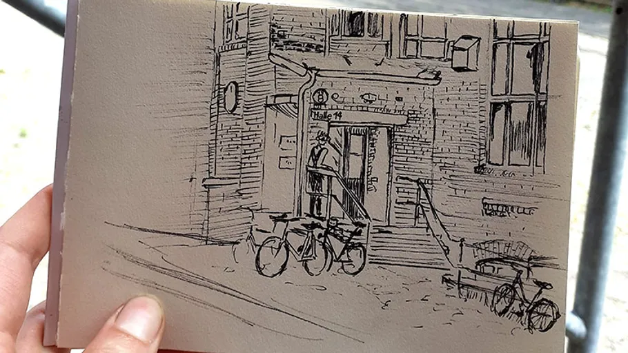 Drawing of building entrance with bicycles outside.
