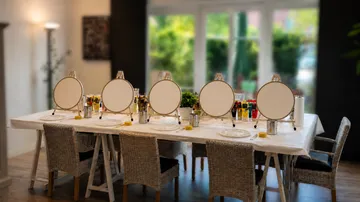 Art workshop with easels on a table.